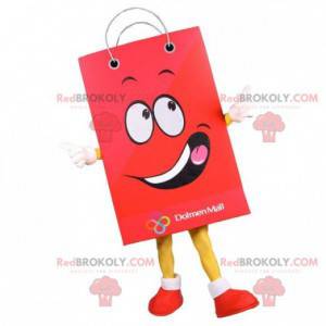 Reusachtige mascotte van een papieren zak. Rode boodschappentas